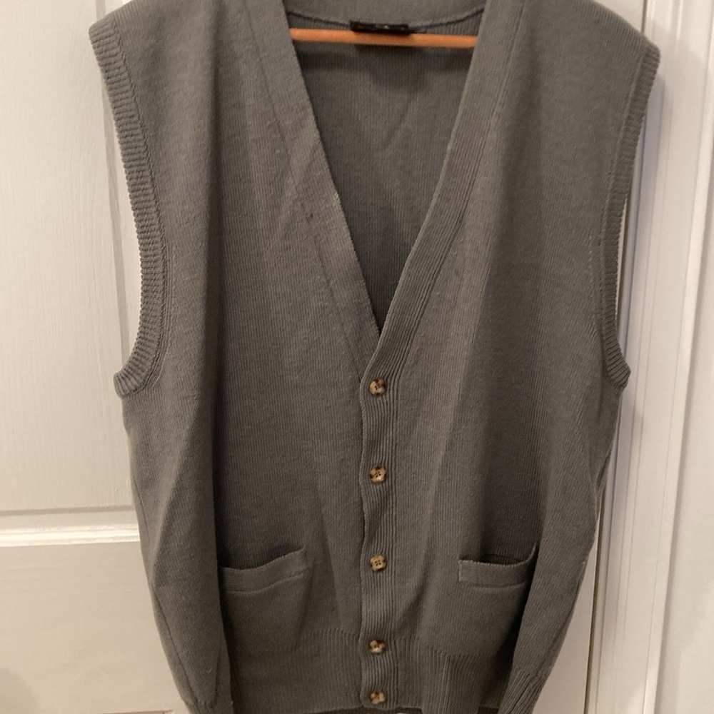 100% wool vest, cardigan style . Made in Australia. Size Large . 23” long